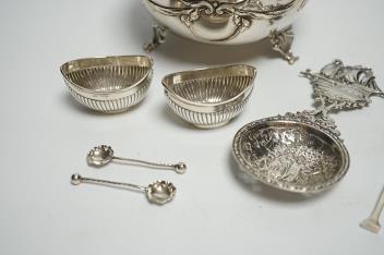 An early 20th century Austro-Hungarian white metal bowl, diameter 13.5cm, a pair of small silver oval salts with spoons, a silver butter knife and an ornate 800 standard white metal spoon.